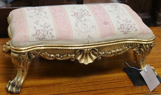 A carved and gilt mahogany footstool W.41cm